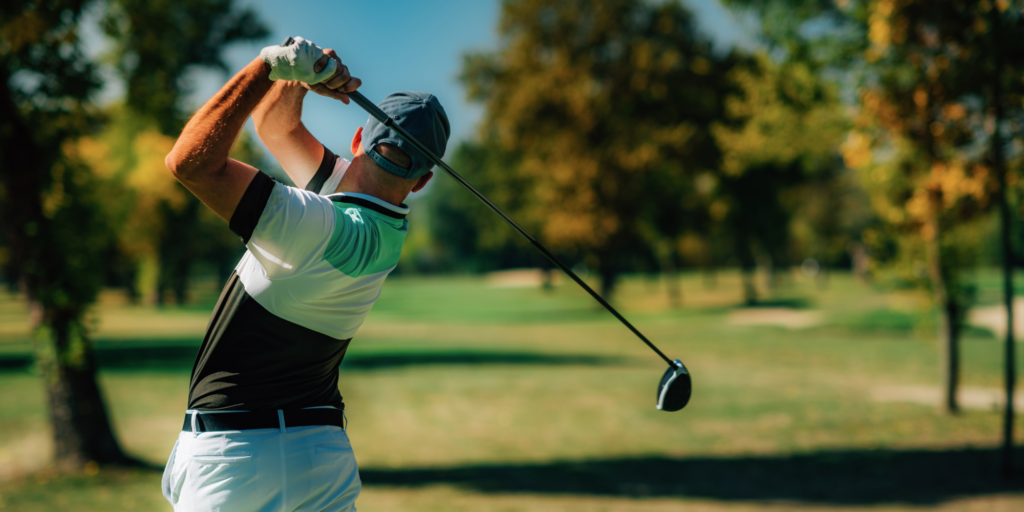 A golfer taking a golf swing with a driver, showing the club face control