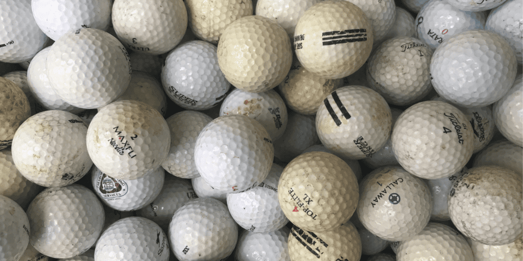 A selection of golf balls with different dimple patterns