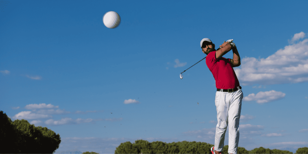 Golfers swinging a golf club to hit a draw shot